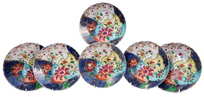 Lot 283 - A set of six Chinese Qianlong period porcelain dishes, of fluted form, polychrome decorated in the 'Tobacco Leaf' pattern, 19.5cm diameter