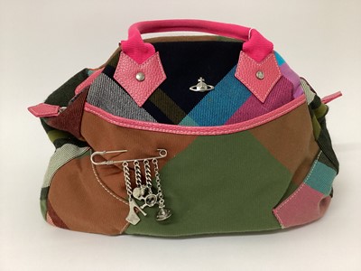 Lot 2075 - Vintage Vivienne Westwood tartan/plaid handbag with metal logo orb and kilt safety pin with charms - orb, high heel, skull and heart. Grey and black logo canvas lining, pink handels and pink leathe...