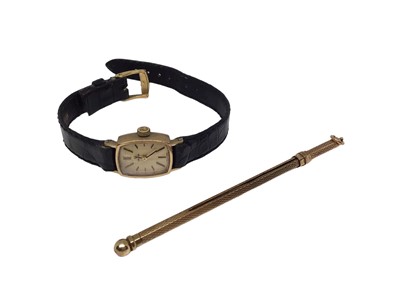 Lot 39 - Ladies 9ct gold cased  Omega wristwatch on a leather strap, together with a 9ct gold cocktail twizzler (2)