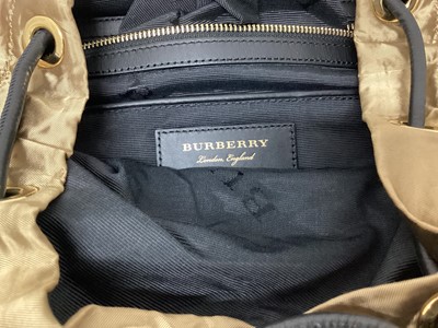 Lot 2077 - Burberry gold silky fabric with black leather and canvas trims, black logo lining and soft dust bag.