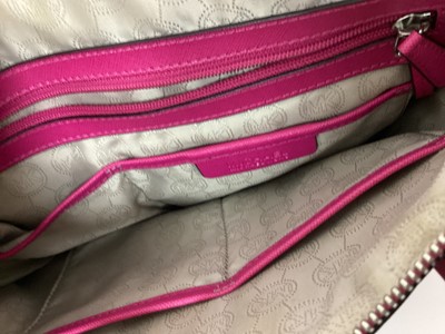 Lot 2079 - Michael Kors Tote bag in Cerise with a gold Michael Kors purse. With large dust bag.