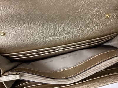 Lot 2079 - Michael Kors Tote bag in Cerise with a gold Michael Kors purse. With large dust bag.
