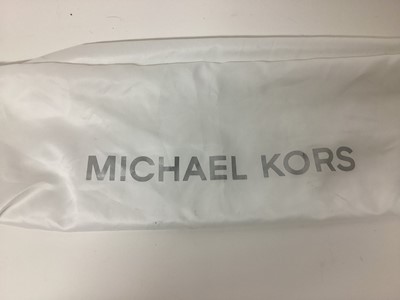 Lot 2079 - Michael Kors Tote bag in Cerise with a gold Michael Kors purse. With large dust bag.