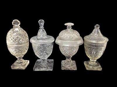 Lot 41 - Group of four 19th century cut glass sweetmeat urns and covers, of varying shapes and sizes, 26cm to 29cm high