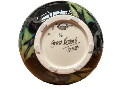 Lot 1193 - Moorcroft pottery vase decorated with birds and foliage on cream and black ground, signed Emma Bossons, dated 14.11.09, 28.5cm high