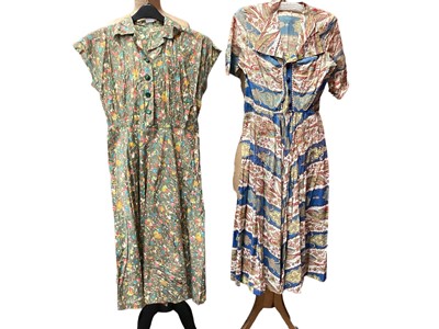 Lot 2095 - 1950s dresses including four with button bodices, side metal zips and flared skirts.  Plus St Michael's pale blue dress with concealed buttons to bodice and flared skirt, also a taffeta style dres...