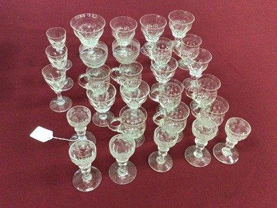 Lot 40 - A group of Victorian and later glassware, including a set of nine Edwardian etched custard cups, a set of six Victorian vine-etched sherry glasses, a pair of engraved coupes, a group of eight Stuar...