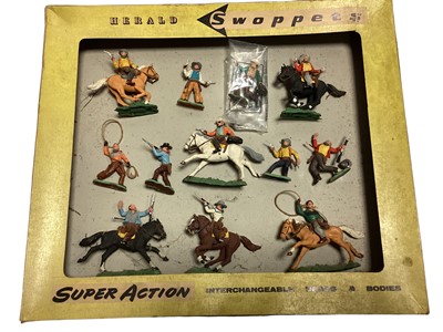 Lot 1868 - Herald Swoppets Super Action Cowboys 6 mounted & 6 foot, with original box (No window & in worn condition (11 cowboys still attached) (1)