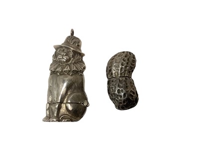 Lot 13 - Two modern silver novelty Vesta cases in the form of Mr Punches dog 65mm and a peanut 40mm (2)