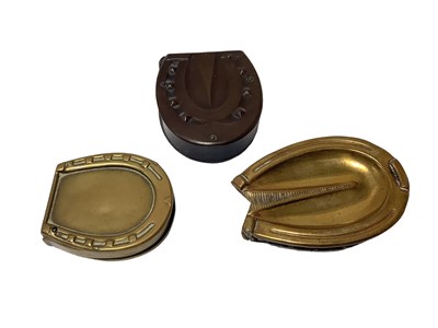 Lot 34 - Three Victorian novelty Vesta cases in the form of horse hooves comprising two brass and a Vulcanite example (3)