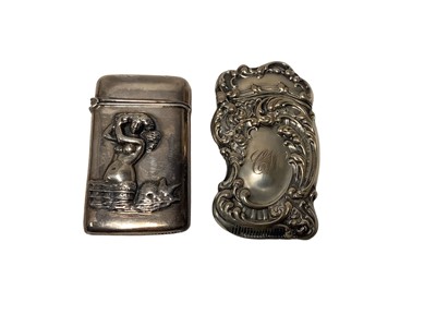 Lot 61 - Ornate late 19th century American  Sterling silver Vesta case with embossed rococo decoration 68 x 40 mm and another Sterling silver Vesta case (2)
