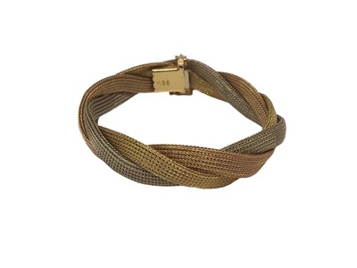 Lot 86 - Three colour gold (stamped 750) three strand plaited bracelet