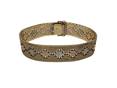 Lot 89 - Three colour gold (stamped 9K) articulated link bracelet