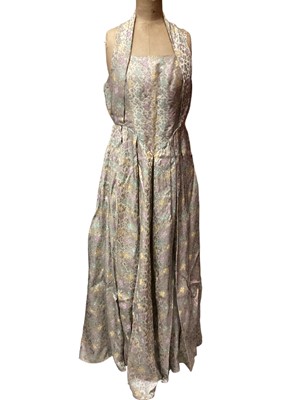 Lot 2142 - 1950s halter neck ballgown by Romney, silver damask with small abstract flowers, plus a navy Corde clutch bag.