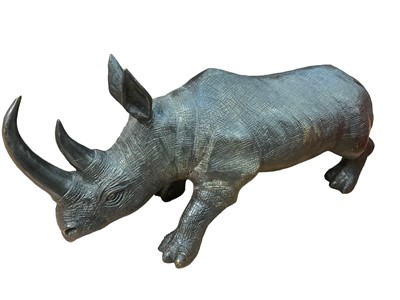 Lot 2550 - Large modern bronze model of a black rhino, 48cm long