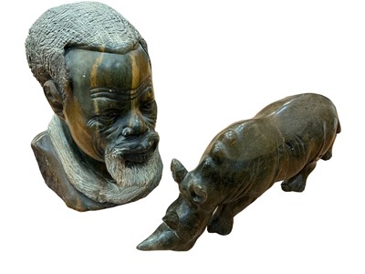 Lot 2551 - Nigerian greenstone carving of a rhinoceros and a similar bust