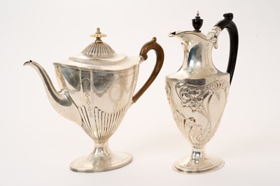 Lot 306 - Victorian silver coffee pot and an Edwardian Art Nouveau silver hot water jug (2)