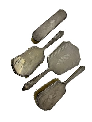 Lot 50 - Art Deco silver four piece dressing table set with engine turned decoration (Birmingham 1932)