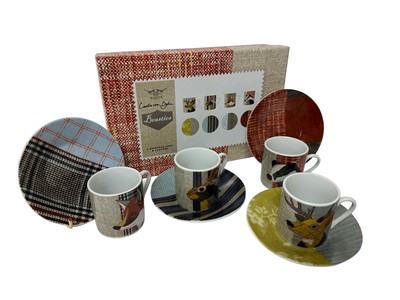 Lot 215 - Set of four modern Carola van Dyke espresso cups and saucers from the 'Beasties' series, in fitted box