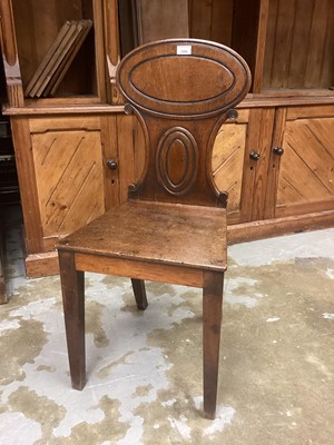 Lot 1298 - Regency mahogany hall chair with oval panelled back, solid seat on taper legs