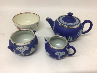 Lot 800 - Wedgwood blue jasper dip small teapot and cover, milk jug and sugar bowl, with silver mounted rims, and a Royal Worcester small round bowl