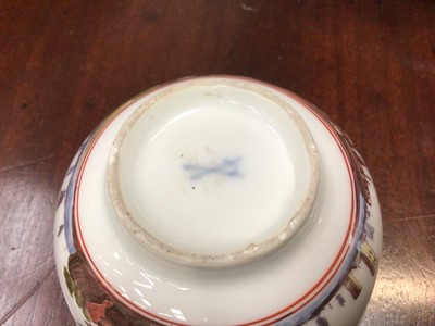 Lot 168 - Meissen tea bowl, painted in coloured enamels with figures and shipping in a continuous estuary landscape, the interior unusually painted in purple monochrome with figures in a harbour scene, circa...