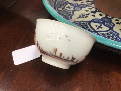 Lot 168 - Meissen tea bowl, painted in coloured enamels with figures and shipping in a continuous estuary landscape, the interior unusually painted in purple monochrome with figures in a harbour scene, circa...