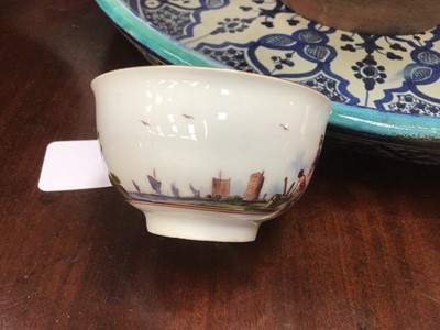 Lot 168 - Meissen tea bowl, painted in coloured enamels with figures and shipping in a continuous estuary landscape, the interior unusually painted in purple monochrome with figures in a harbour scene, circa...