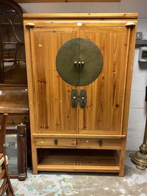 Lot 1325 - Eastern pine television cabinet/ cupboard with brass mounts and drawers and shelf below 106 cm wide, 175cm high, 53cm deep