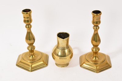Lot 933 - Pair of Queen Anne brass candlesticks, together with 18th century bell metal jug