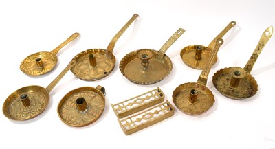 Lot 934 - Small collection of eight Arts and Crafts brass chambersticks