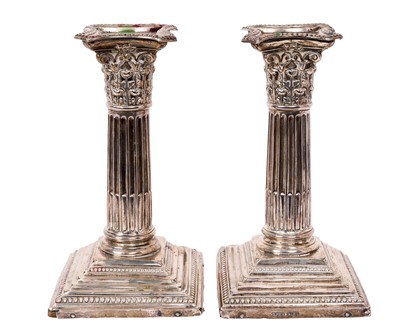 Lot 331 - Pair of late Victorian silver Corinthian candlesticks