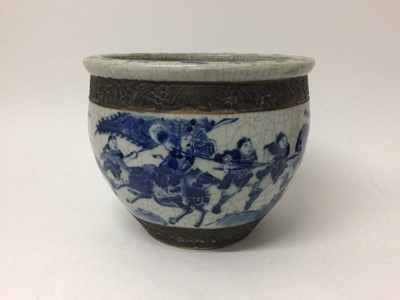 Lot 11 - 19th century Chinese blue and white crackle glazed jardinière, decorated with a continuous battle scene, 27cm diameter x 22cm high