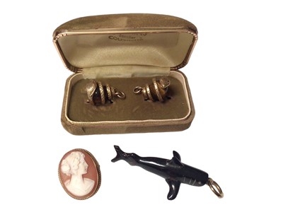 Lot 62 - Pair of tigers eye spheres in yellow metal coiled snake pendant mounts, a carved black coral shark pendant and a 9ct gold cameo brooch