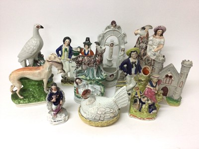 Lot 51 - Group of 19th century Staffordshire figures, including a greyhound, hen on nest, two goat groups, etc