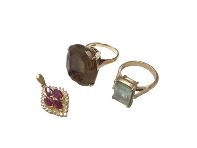Lot 73 - Diamond and synthetic ruby pendant in yellow metal setting and two 9ct gold gem set cocktail rings (3)