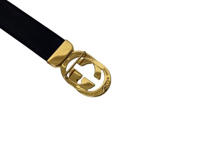 Lot 2060 - Gucci black leather waist belt, with gilt metal 'GG' logo buckle, in a Gucci box