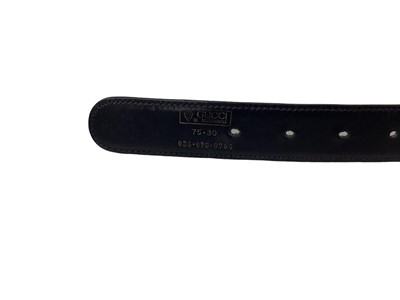 Lot 2060 - Gucci black leather waist belt, with gilt metal 'GG' logo buckle, in a Gucci box