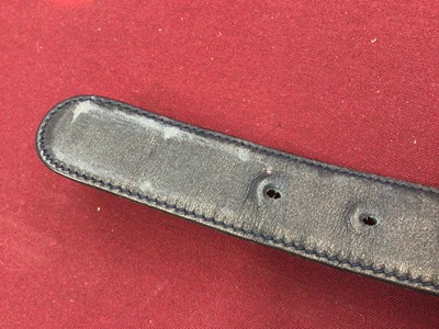 Lot 2060 - Gucci black leather waist belt, with gilt metal 'GG' logo buckle, in a Gucci box