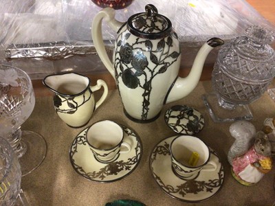 Lot 66 - Continental porcelain coffee set overlaid in sterling silver foliate scroll panels