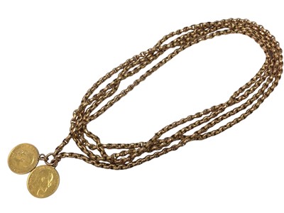 Lot 60 - Victorian 9ct rose gold long guard chain mounted with Two gold half sovereigns