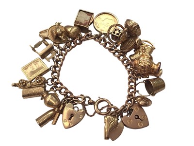 Lot 26 - 9ct gold charm bracelet with various 9ct gold charms including a Victorian gold half sovereign, 1899