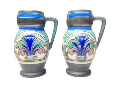 Lot 1105 - Pair of Gouda pottery ewers