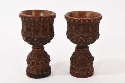 Lot 962 - Pair of carved wood small cups