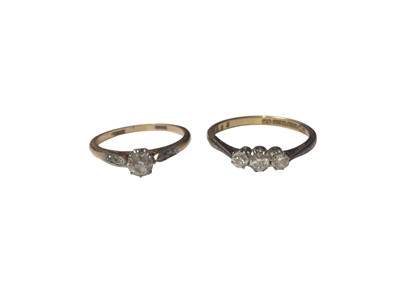 Lot 16 - 18ct gold diamond single stone ring with diamond set shoulders in platinum setting and an 18ct gold diamond three stone ring in platinum setting (2)
