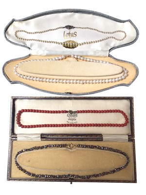 Lot 68 - Old coral bead necklace with a string of coral beads on gold clasp, a freshwater grey cultured pearl necklace on 18ct gold clasp, a freshwater cultured pearl necklace on gold clasp and a vintage si...