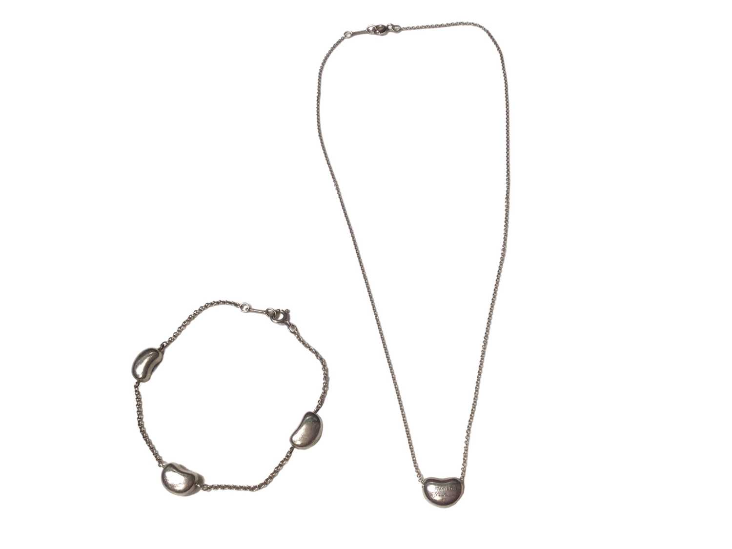 Lot 70 - Tiffany & Co silver 'Bean' necklace and bracelet designed by Elsa Peretti