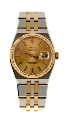 Lot 722 - Gentlemen's Rolex Oysterquartz Datejust chronometer wristwatch, model 17013, with champagne coloured dial, gold bezel, in stainless steel Oyster case on bi-metal integral bracelet, with original gu...