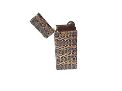 Lot 90 - Silver and 18ct gold lighter by Graff
