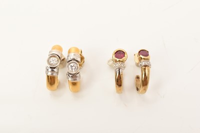 Lot 670 - Pair of 18ct white and yellow gold earrings set with a brilliant cut diamond weighing approximately 0.10cts each, together with a pair of 9ct gold ruby and diamond earrings (2)